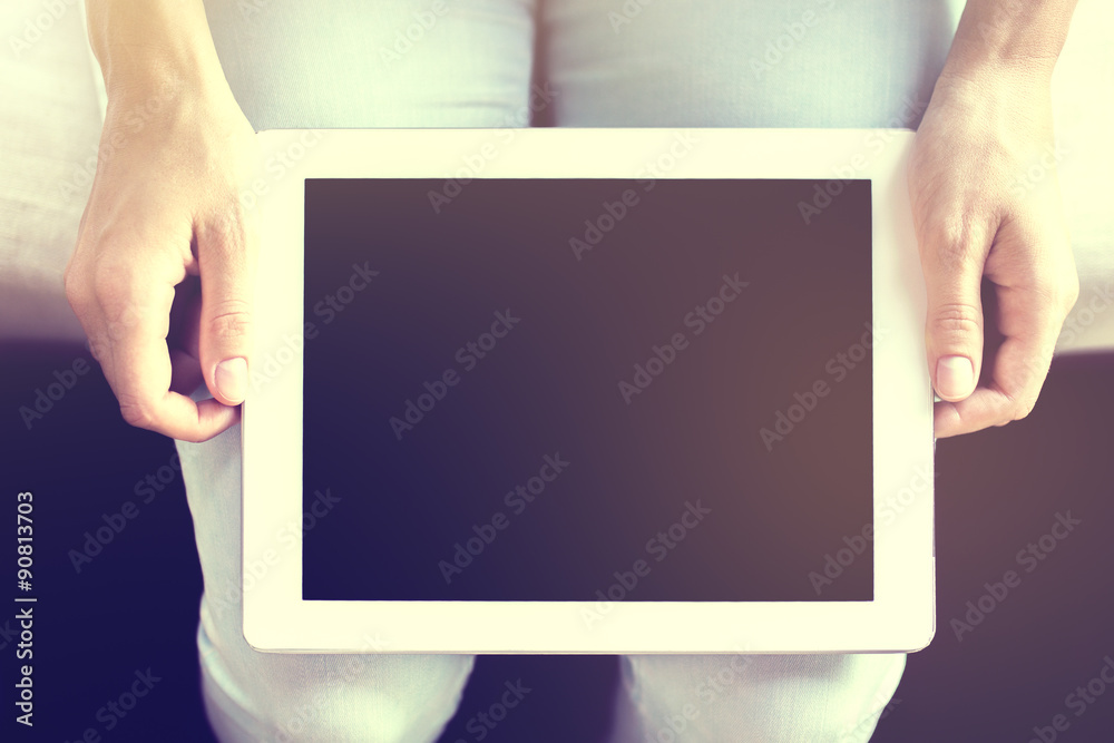 Digital tablet with girl hands