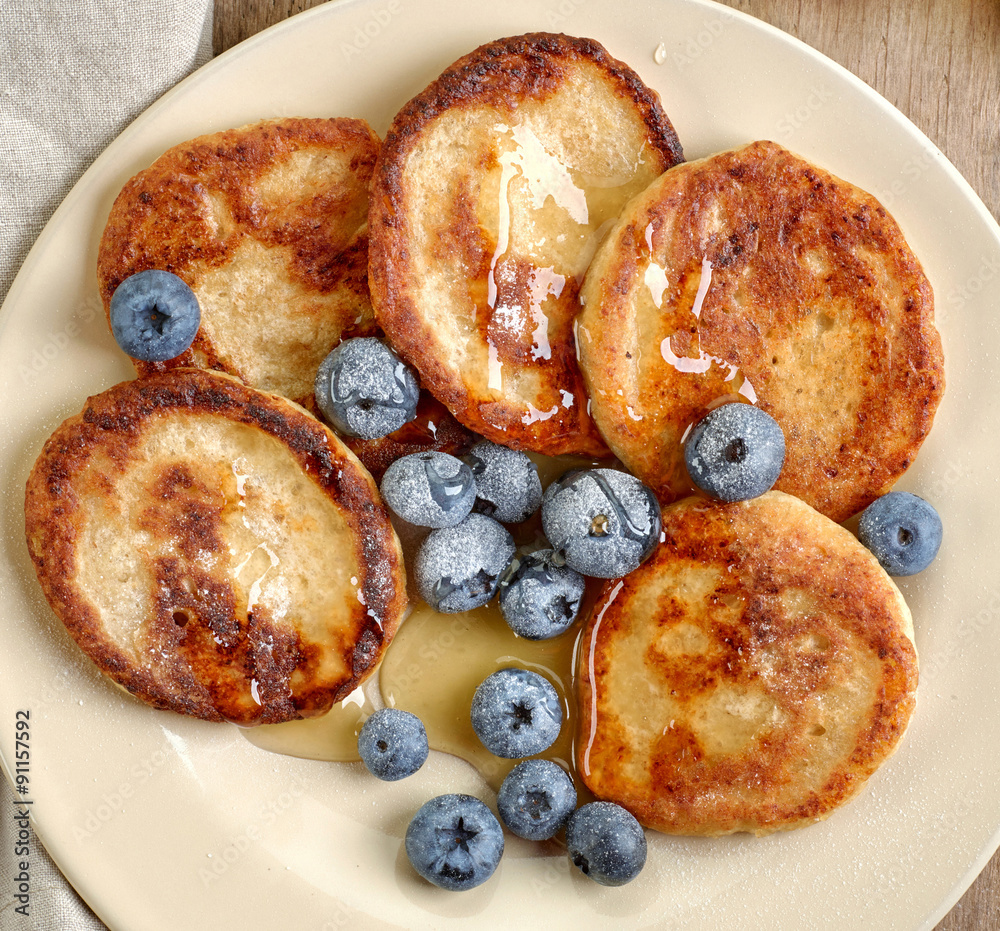 Pancakes with honey and blueberries