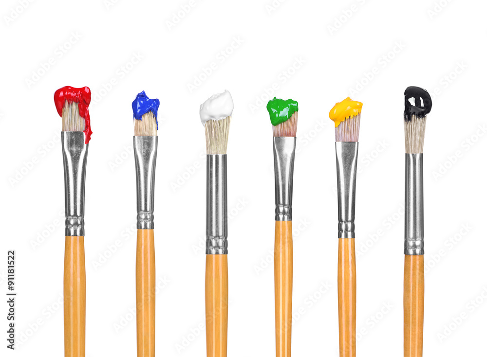 close up of paint brushes on white background