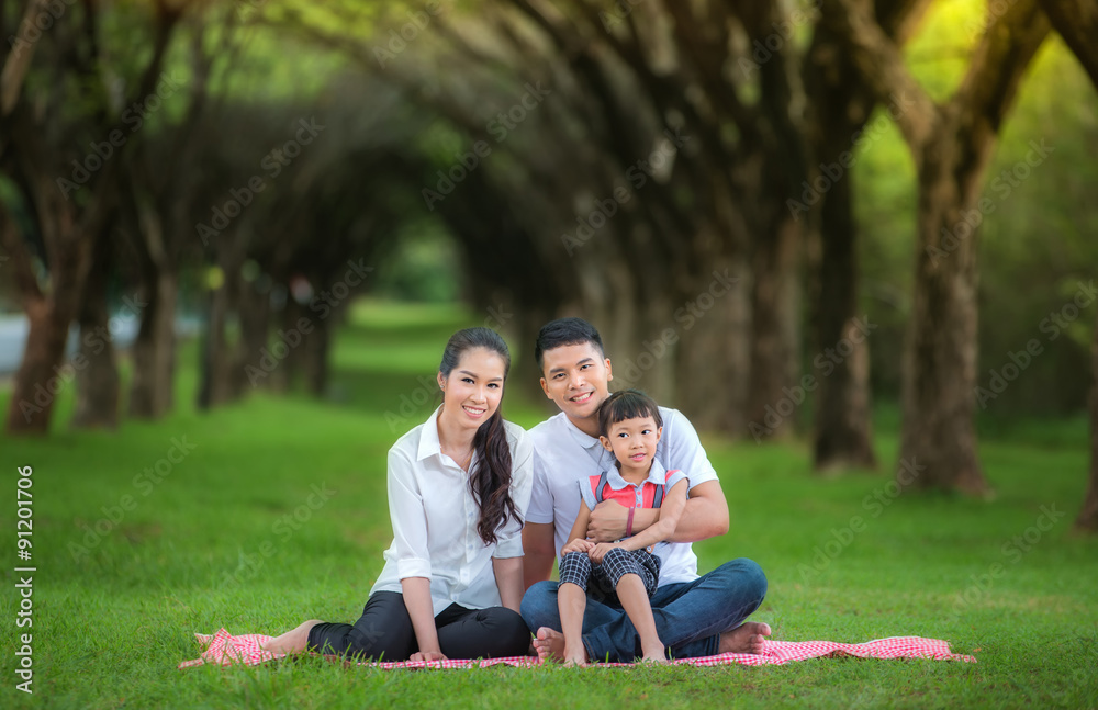 Happy asian mother, father and daughter