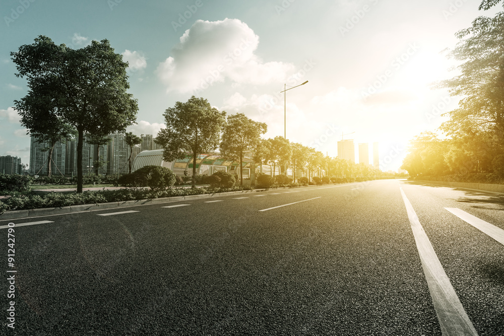 empty asphalt road under sunshine