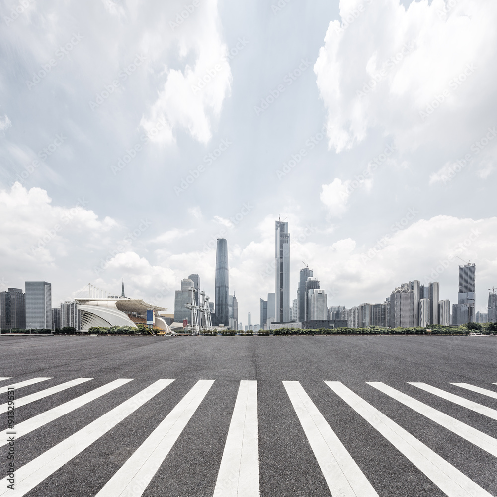 empty road with zebra crossing and skyscrapers