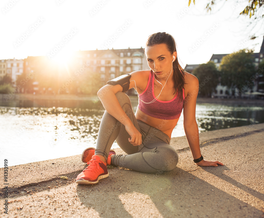 Female runner taking a rest from training