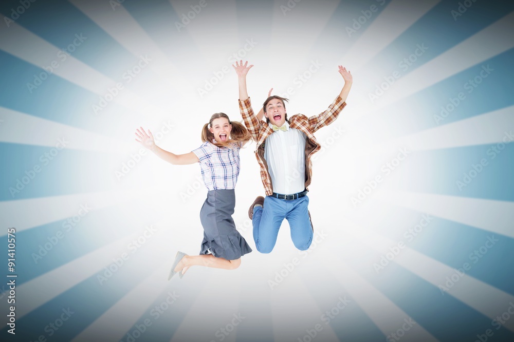 Composite image of geeky hipsters jumping and smiling