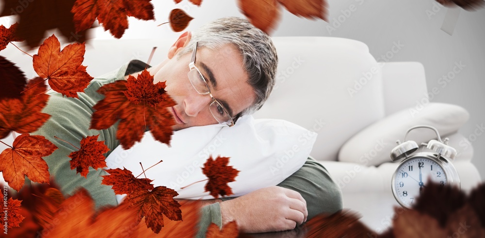 Composite image of man resting on cushion