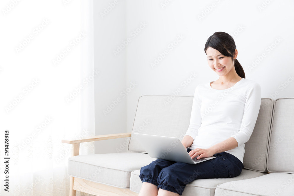 attractive asian woman using laptop