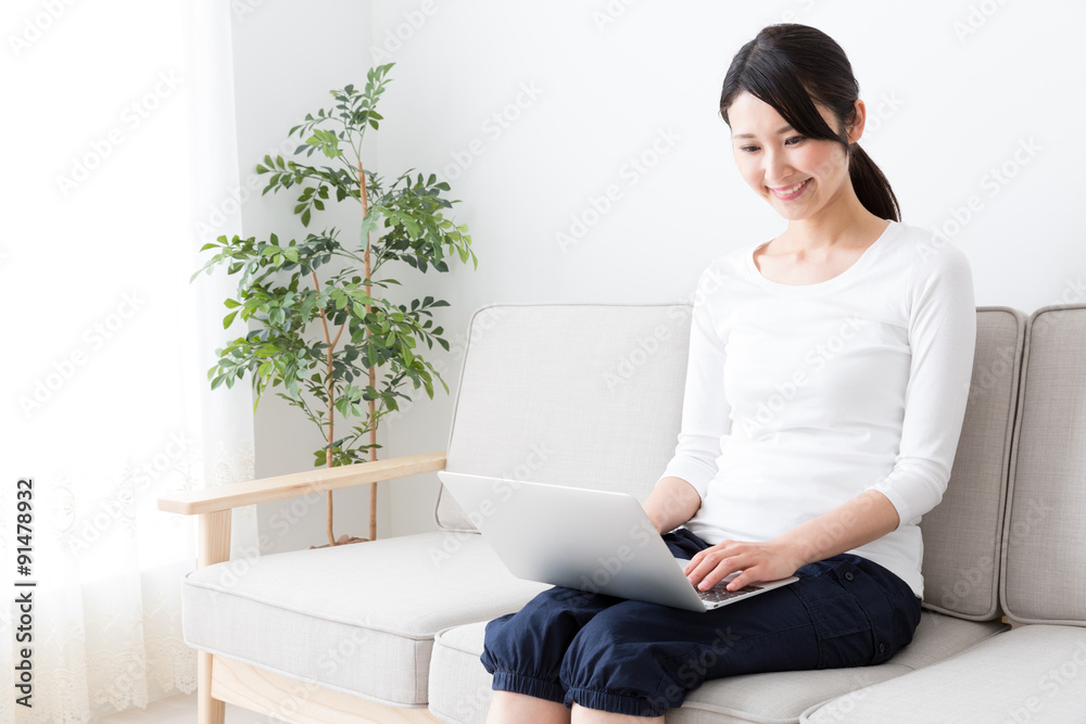 attractive asian woman using laptop