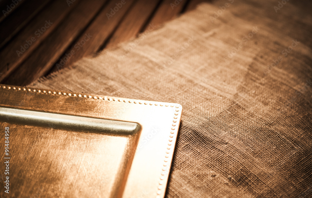 gold tray. wood texture and textiles