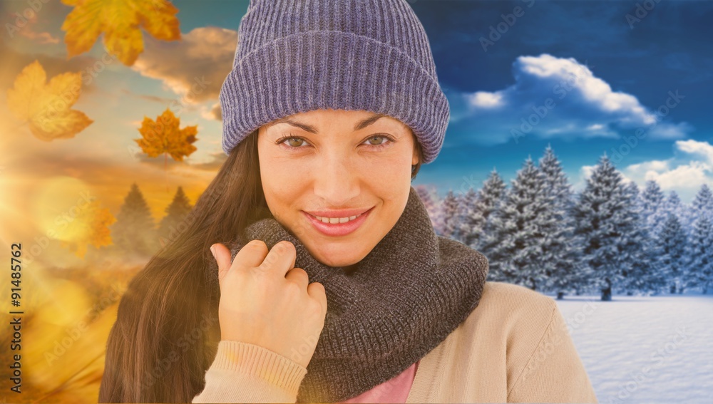 Composite image of attractive brunette looking at camera