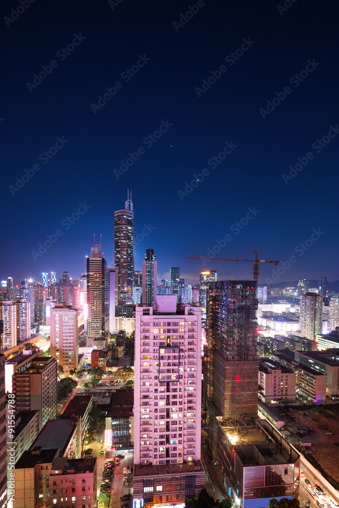 panorama of skyscrapers in a modern city at night