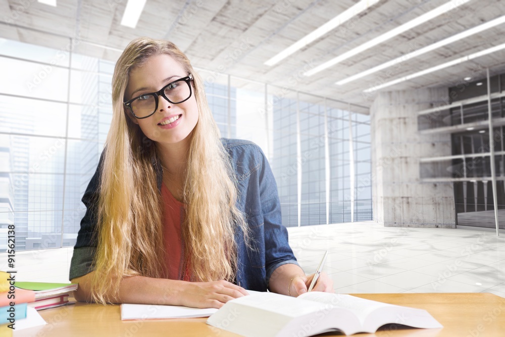 Composite image of student studying in the library 