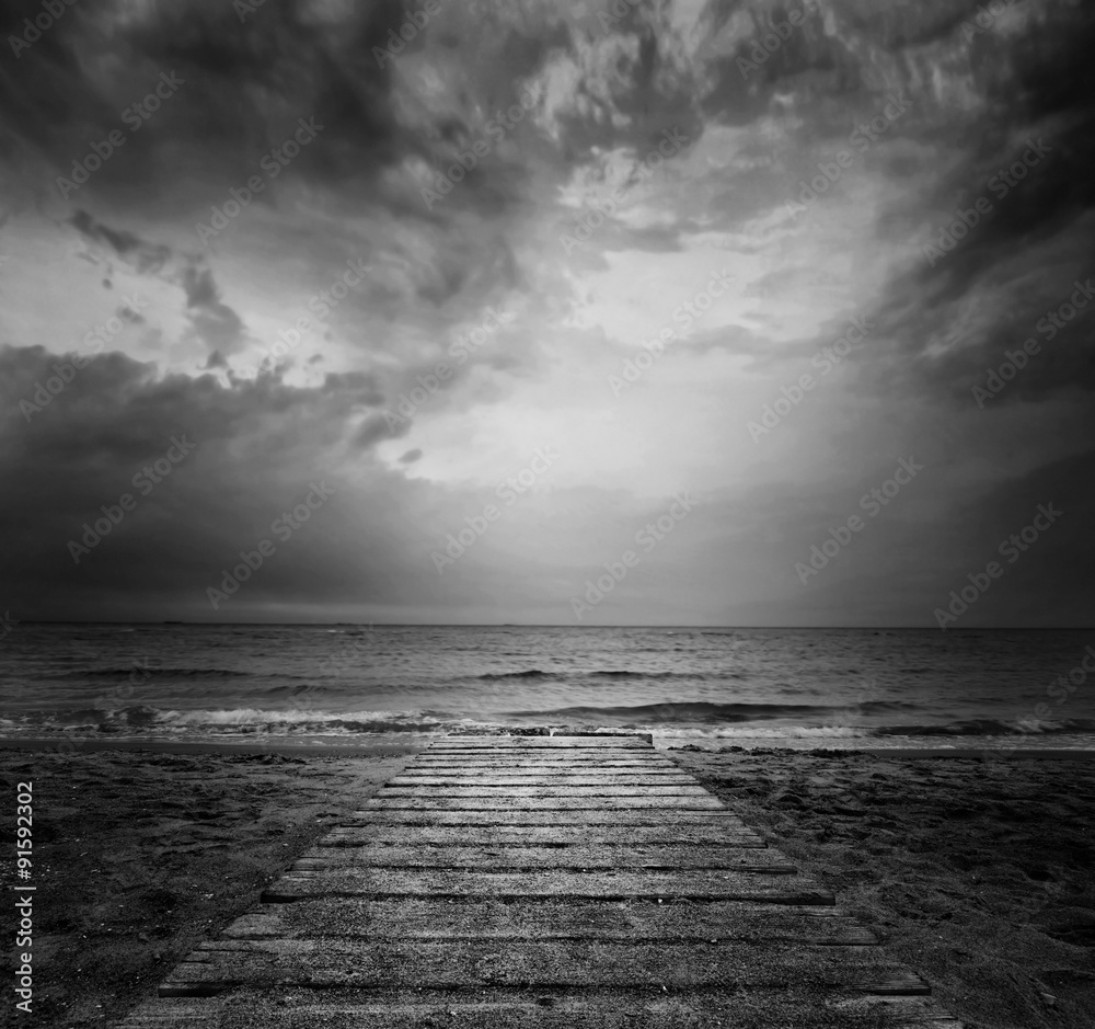 Bridge into the sea - loneliness concept in BW