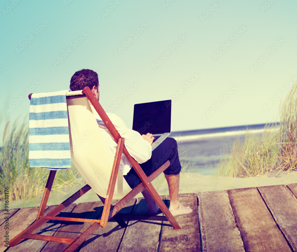 Businessman Working by the Beach Relaxation Concept