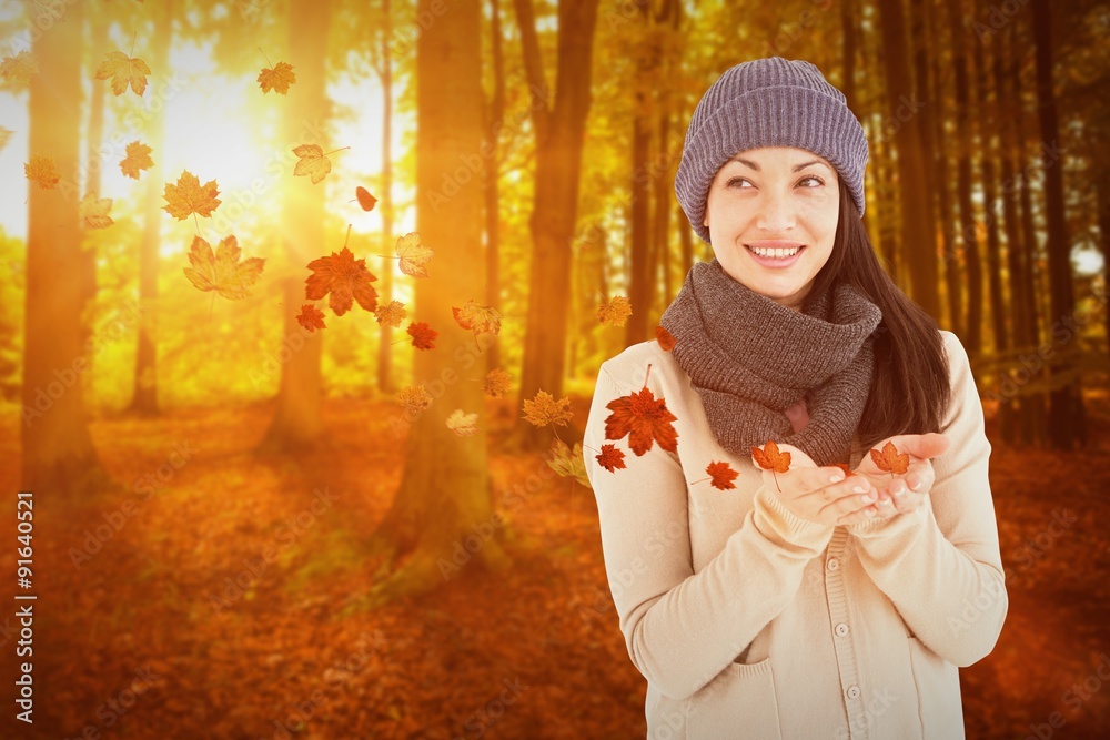 Composite image of smiling brunette presenting her hands