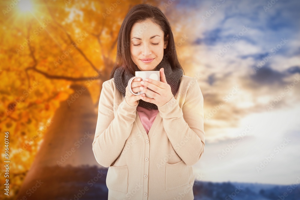 Composite image of smiling woman smelling hot beverage