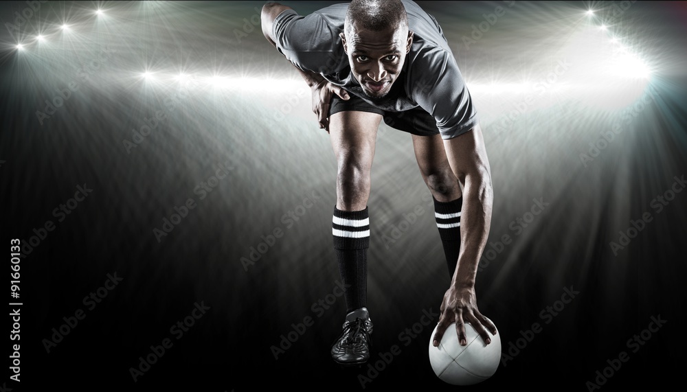 Composite image of portrait of rugby player smiling