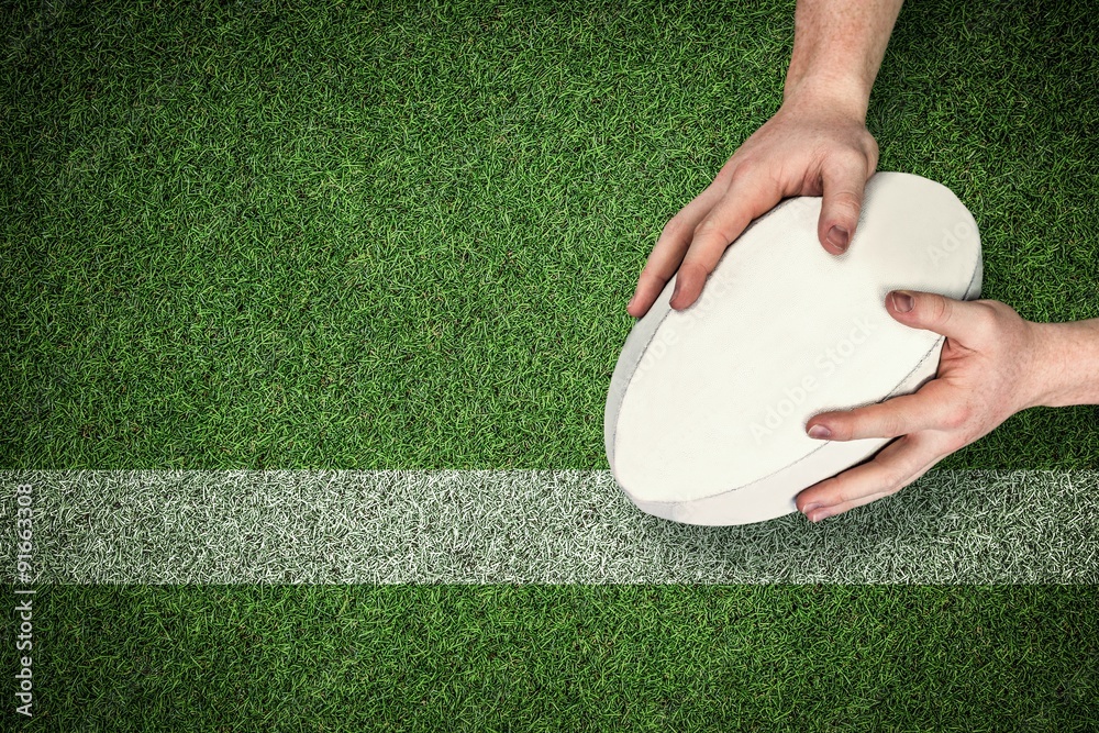 Composite image of a rugby player scoring a try