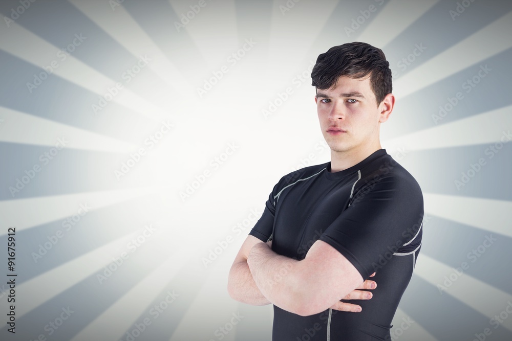 Composite image of portrait of a rugby player with arms crossed