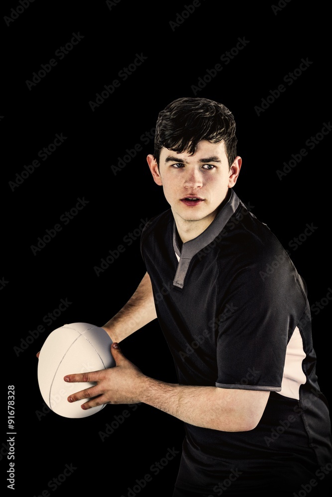 Composite image of rugby player about to throw a rugby ball