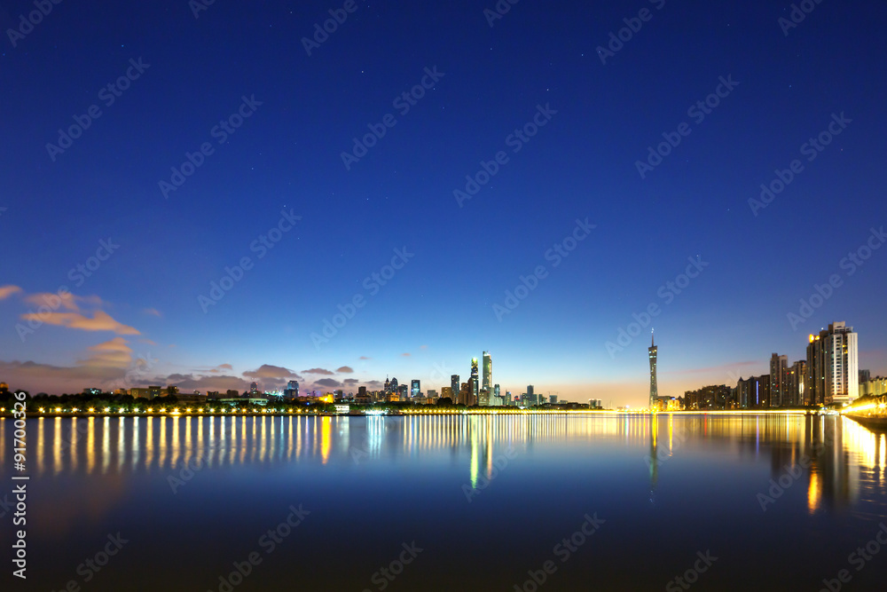 skyscrapers near the river at night