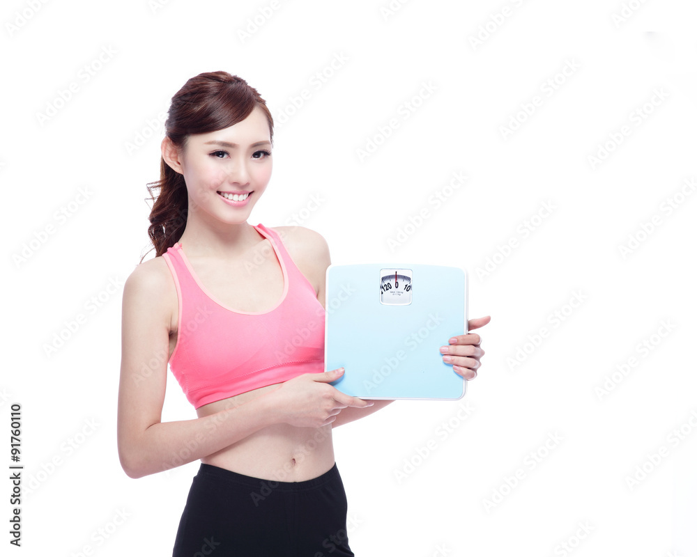 Sport girl hold weight scale