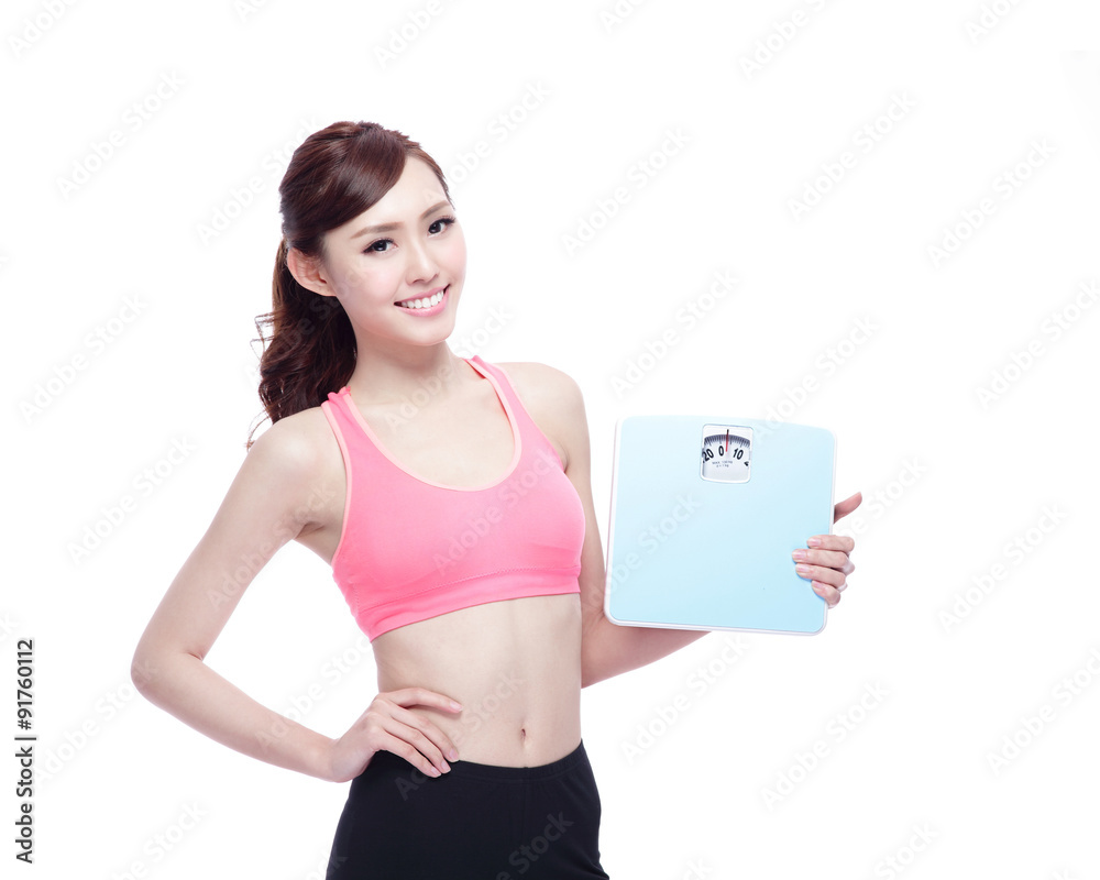 Sport girl hold weight scale