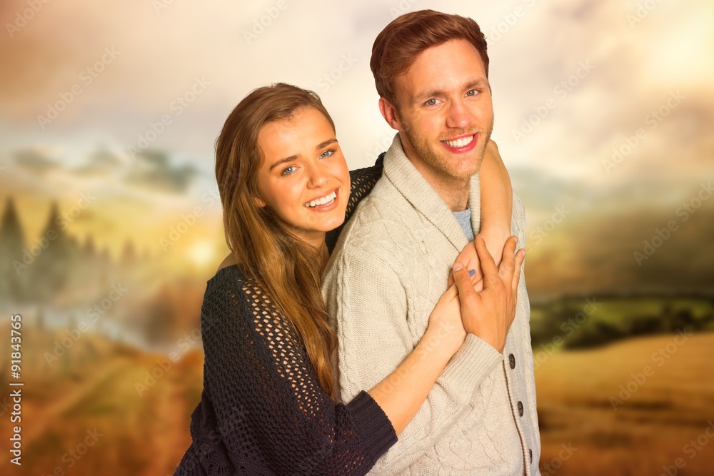 Composite image of portrait of happy young couple