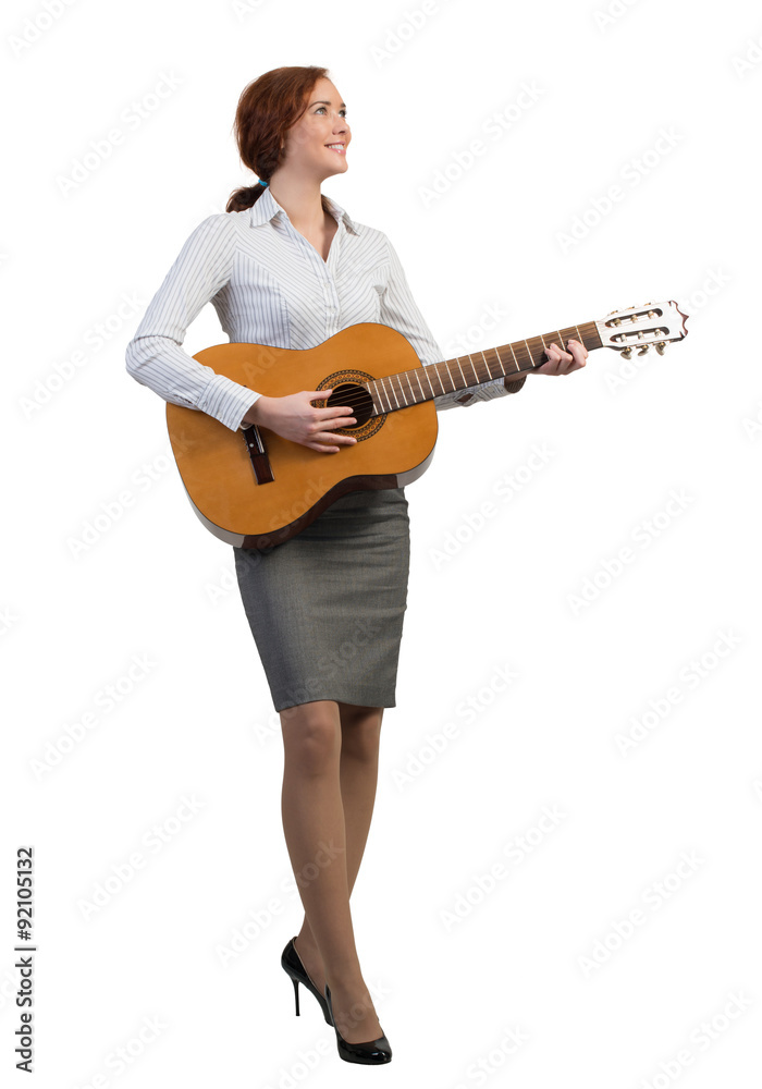 Businesswoman with guitar