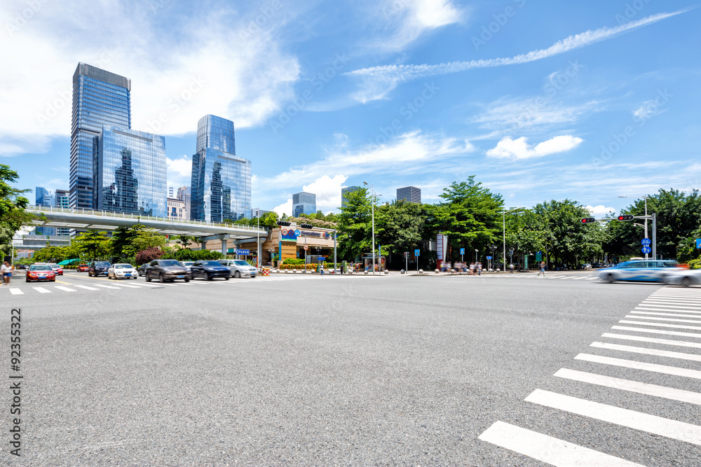 empty asphalt road of a modern city with skyscrapers