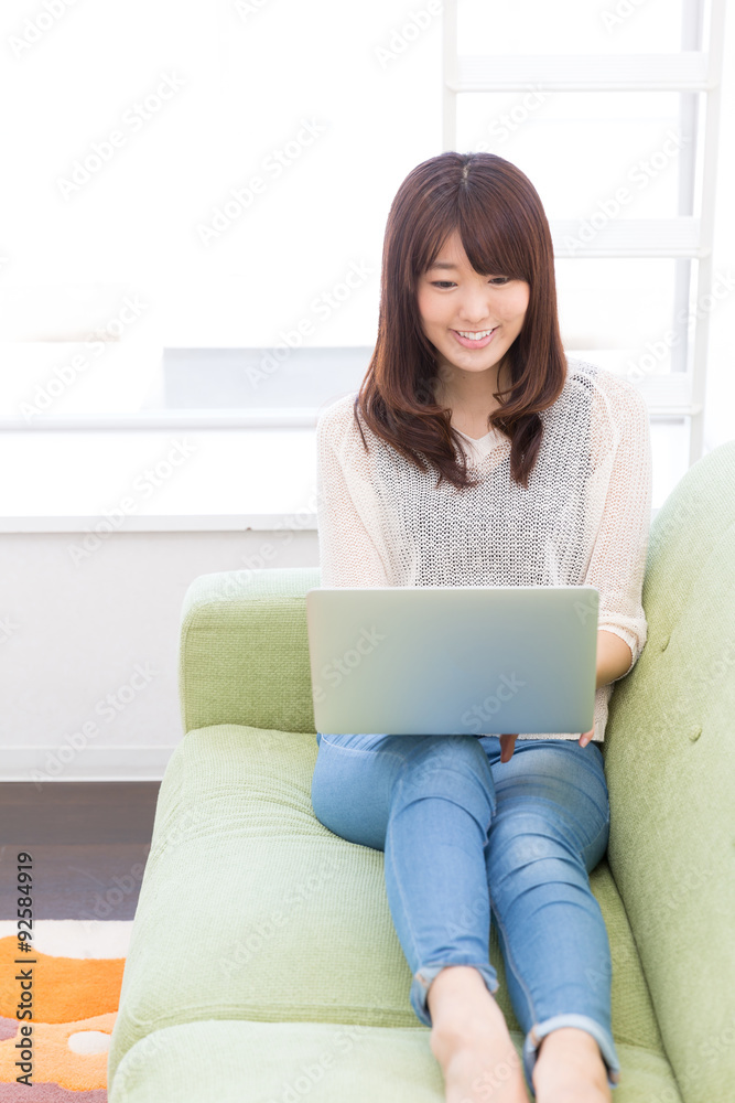 young asian woman using laptop