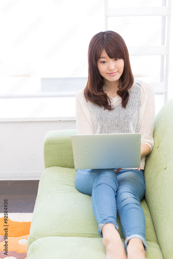 young asian woman using laptop