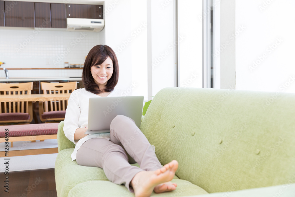 young asian woman using laptop