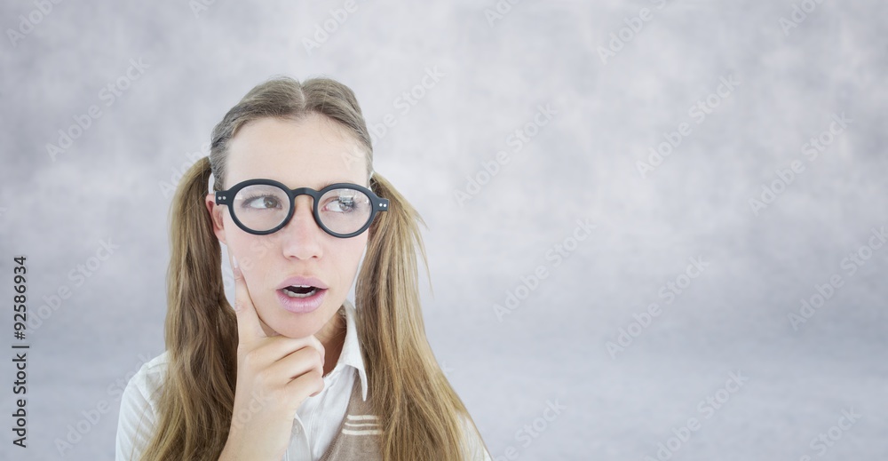 Composite image of female geeky hipster looking confused 