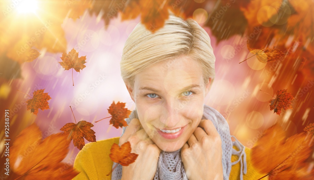 Composite image of smiling woman wearing a scarf