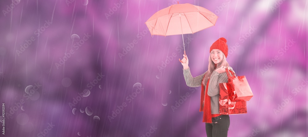 节日金发女郎撑着雨伞和包包的合成图像