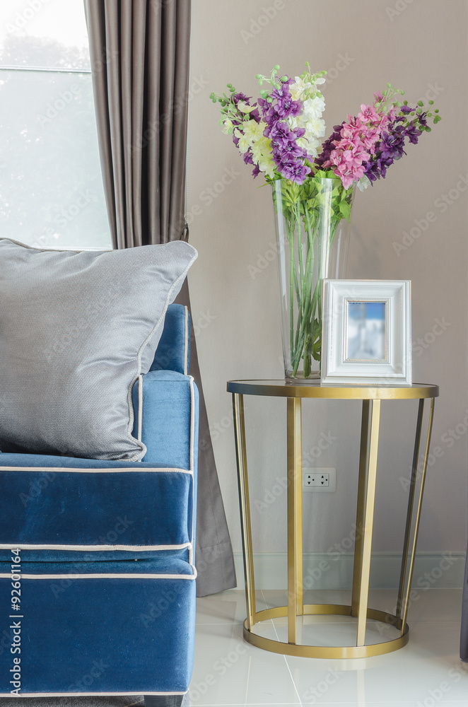 glass vase of flower with white picture frame on classic table s