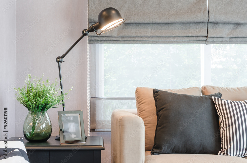 modern living room with black lamp on table side