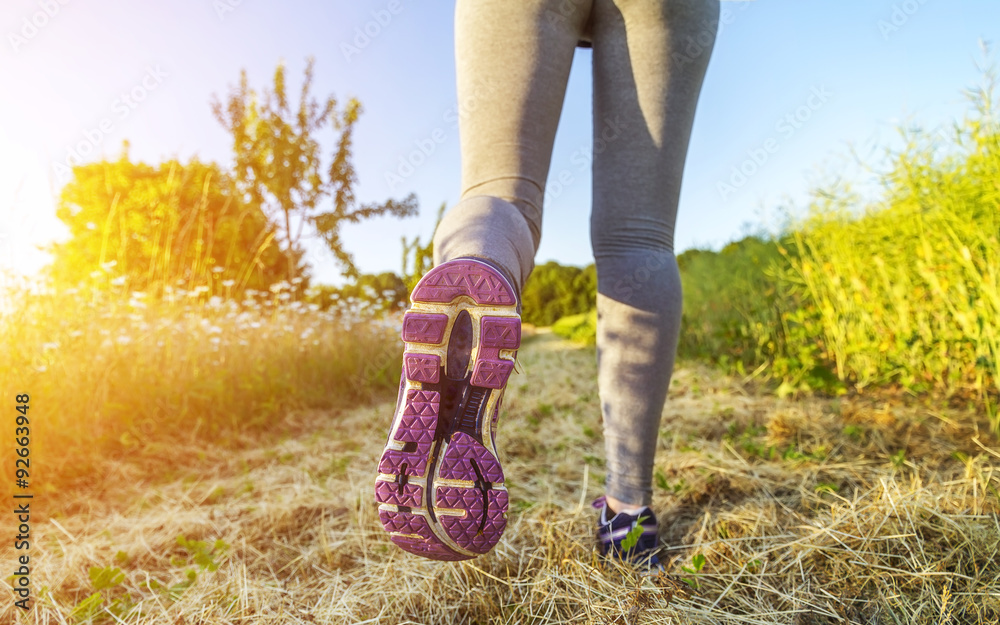 Woman running in a field