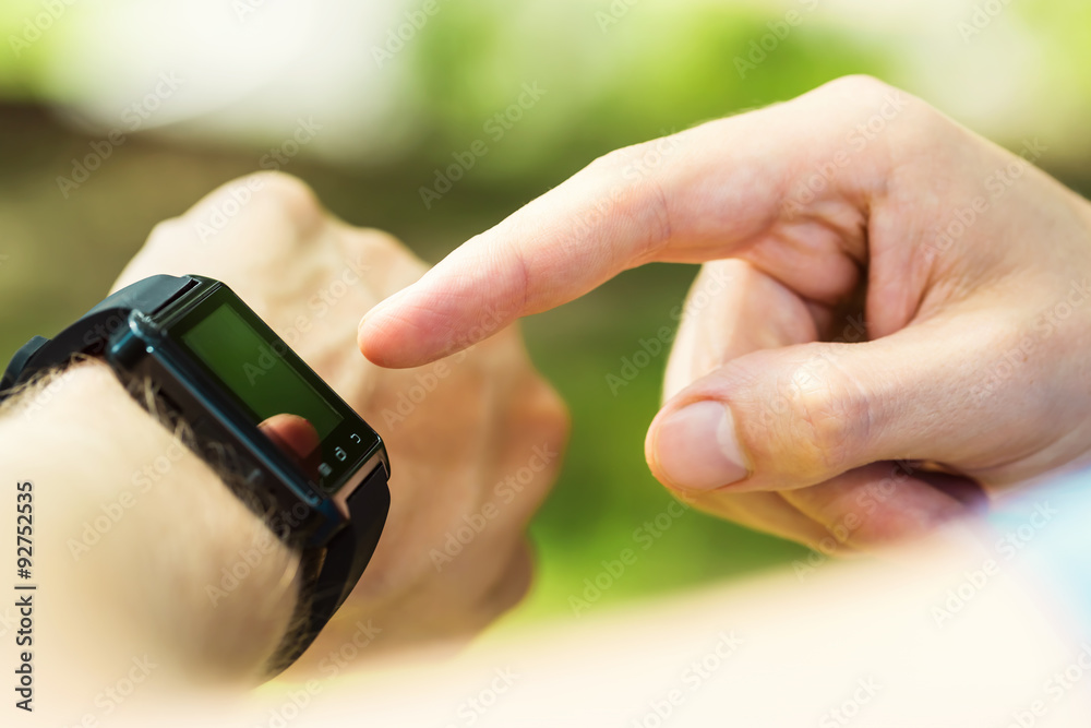 Man looking at his smartwatch