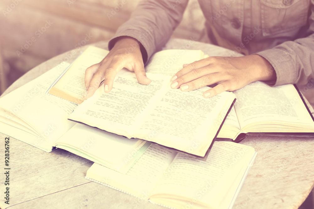 Girl with many open books