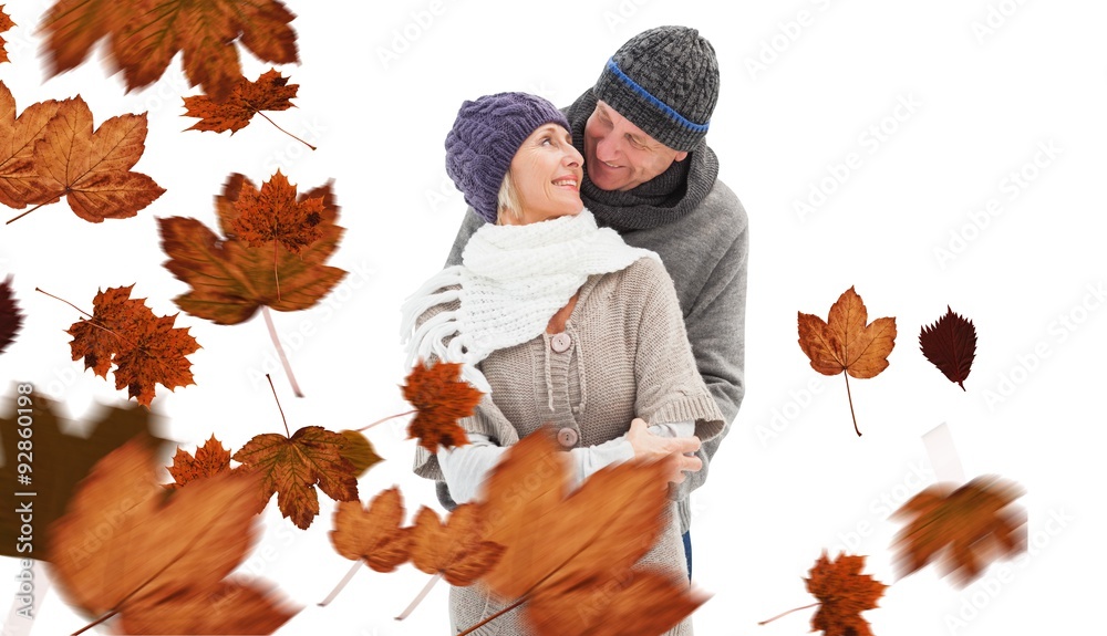 Composite image of happy mature couple in winter clothes