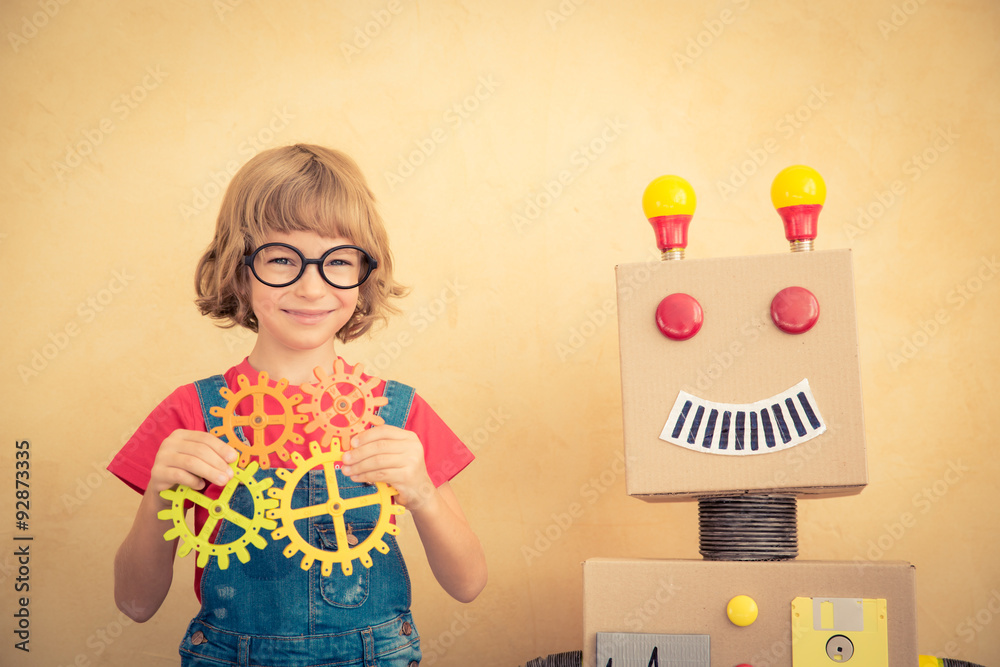 Funny nerd child with toy robot