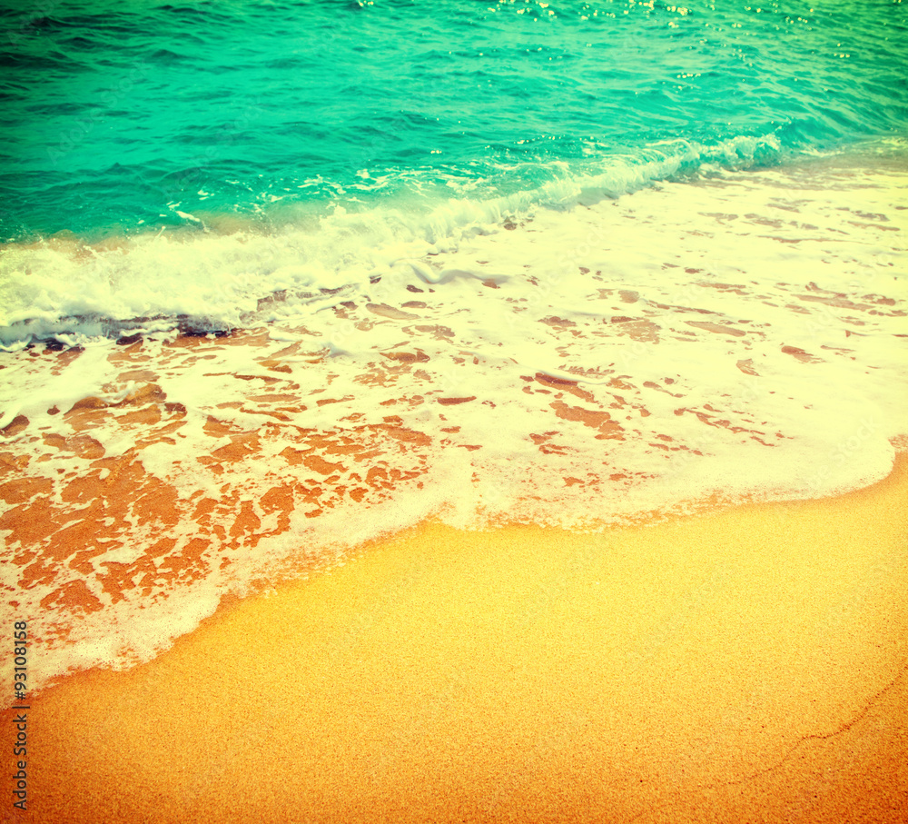 Golden sand beach with blue ocean waves