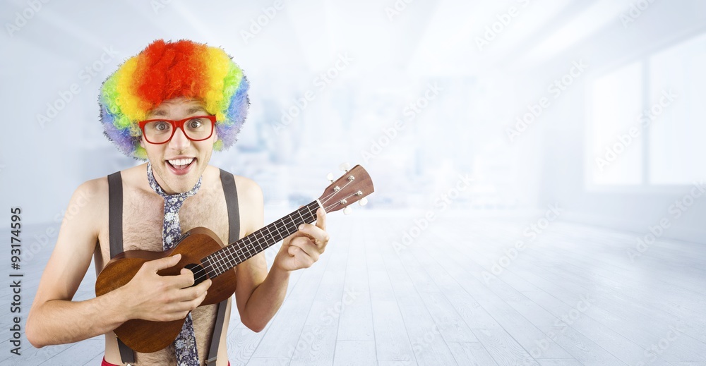 Composite image of geeky hipster in afro rainbow wig