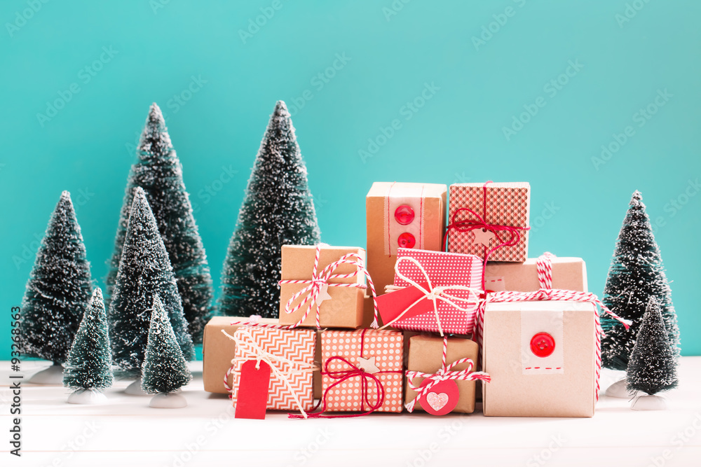 Little gift boxes in miniature evergreen forest