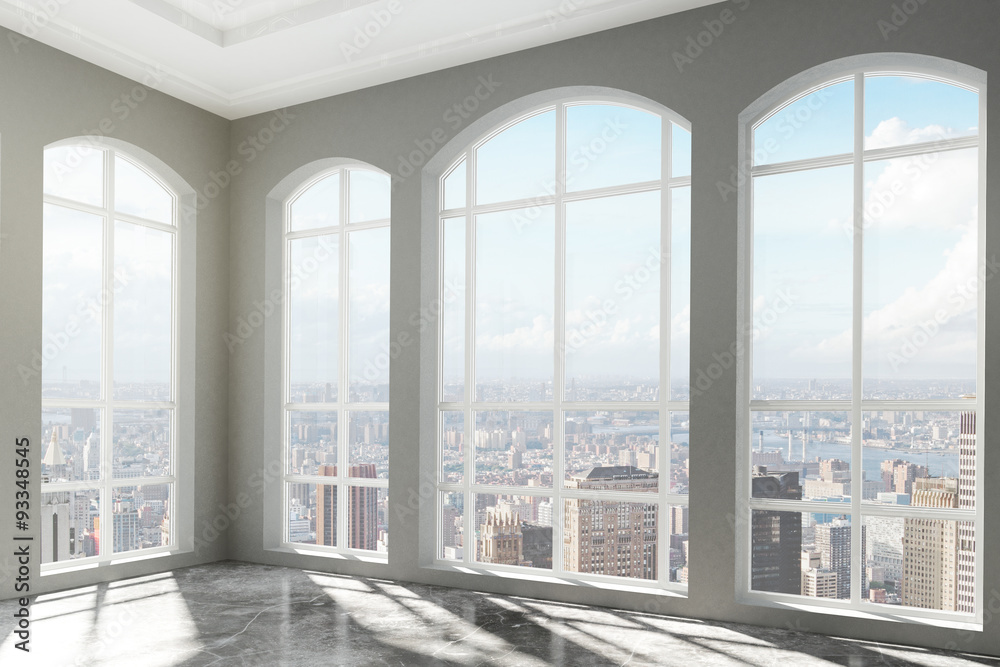 Loft interior with big windows and city view