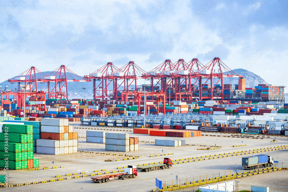 busy harbour with full loads of containers