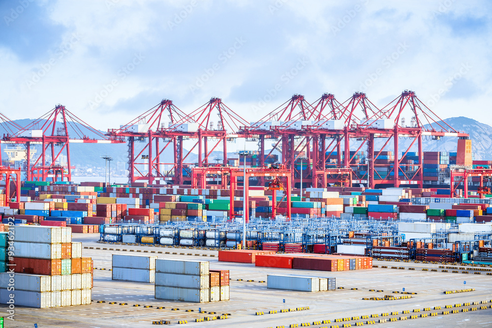 busy harbour with full loads of containers