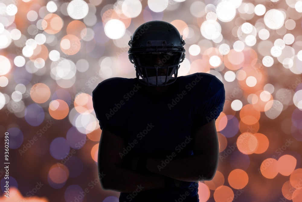 Composite image of silhouette american football player standing