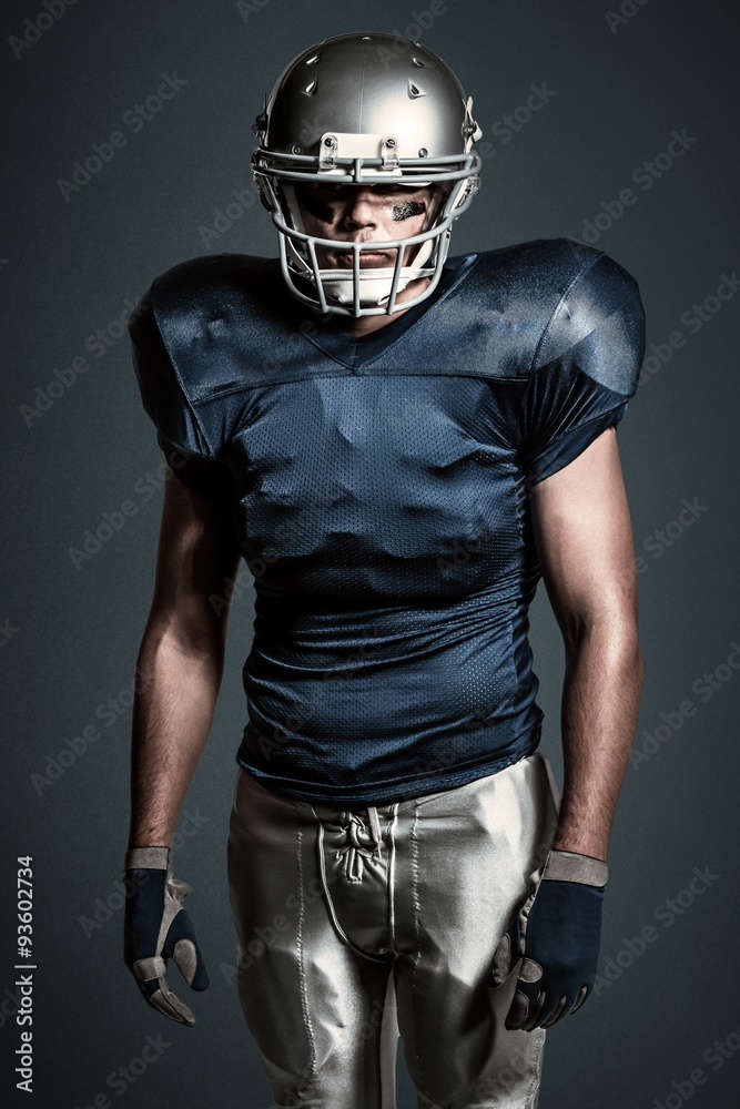 Composite image of american football player standing